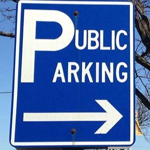 A blue sign that reads, "Public Parking" in white print.
